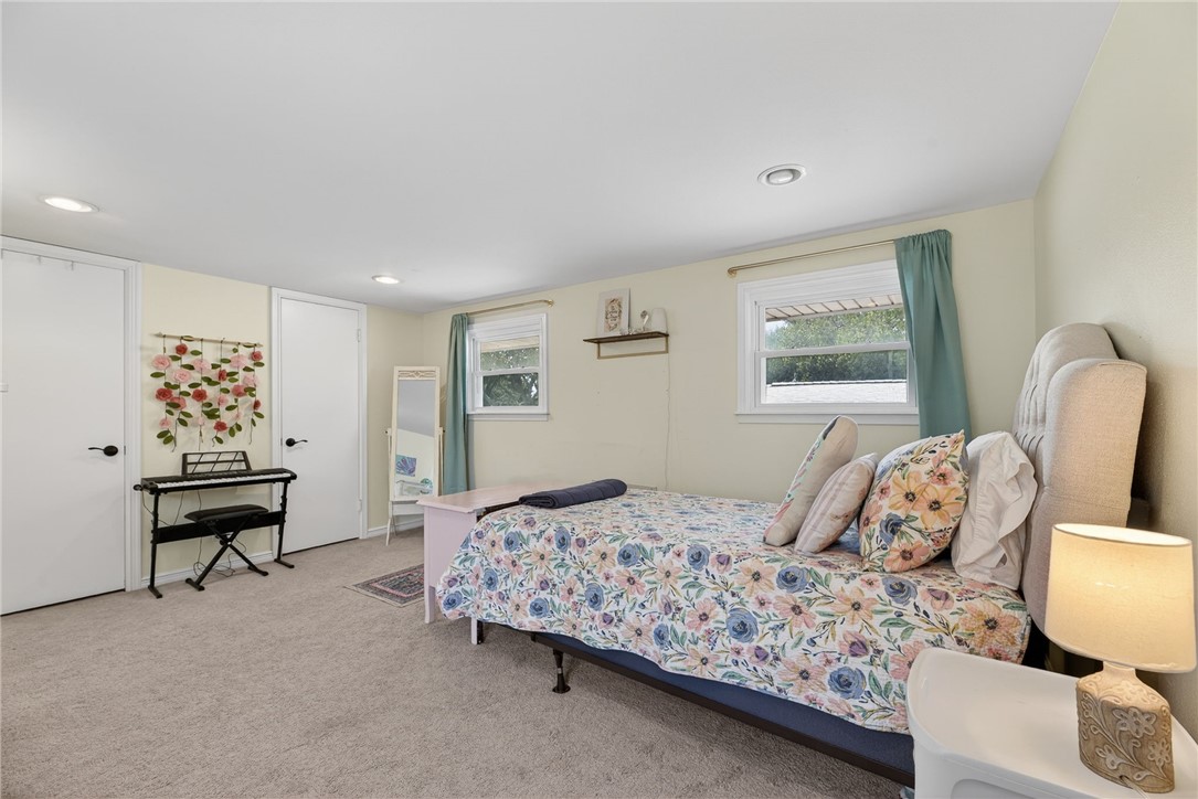 609 Peerman Place Corpus Christi, TX 78411 - Photo 28 of 36 a bedroom with a bed and wooden floor