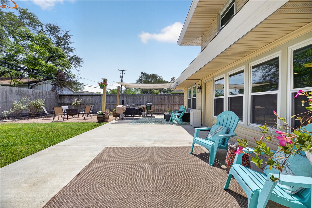 609 Peerman Place Corpus Christi, TX 78411 - Photo 31 of 36 a swimming pool with outdoor seating and garden