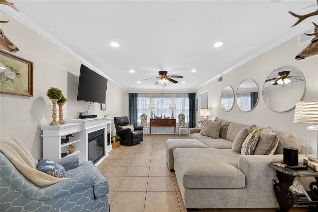 609 Peerman Place Corpus Christi, TX 78411 - Photo 5 of 36 a living room with furniture and a flat screen tv