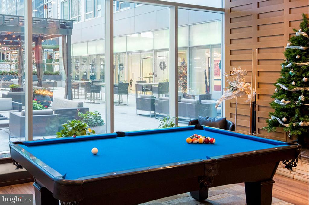 1900-20 Arch Street, Unit 108 Philadelphia, PA 19103 - Photo 21 of 27 a room with pool table and windows