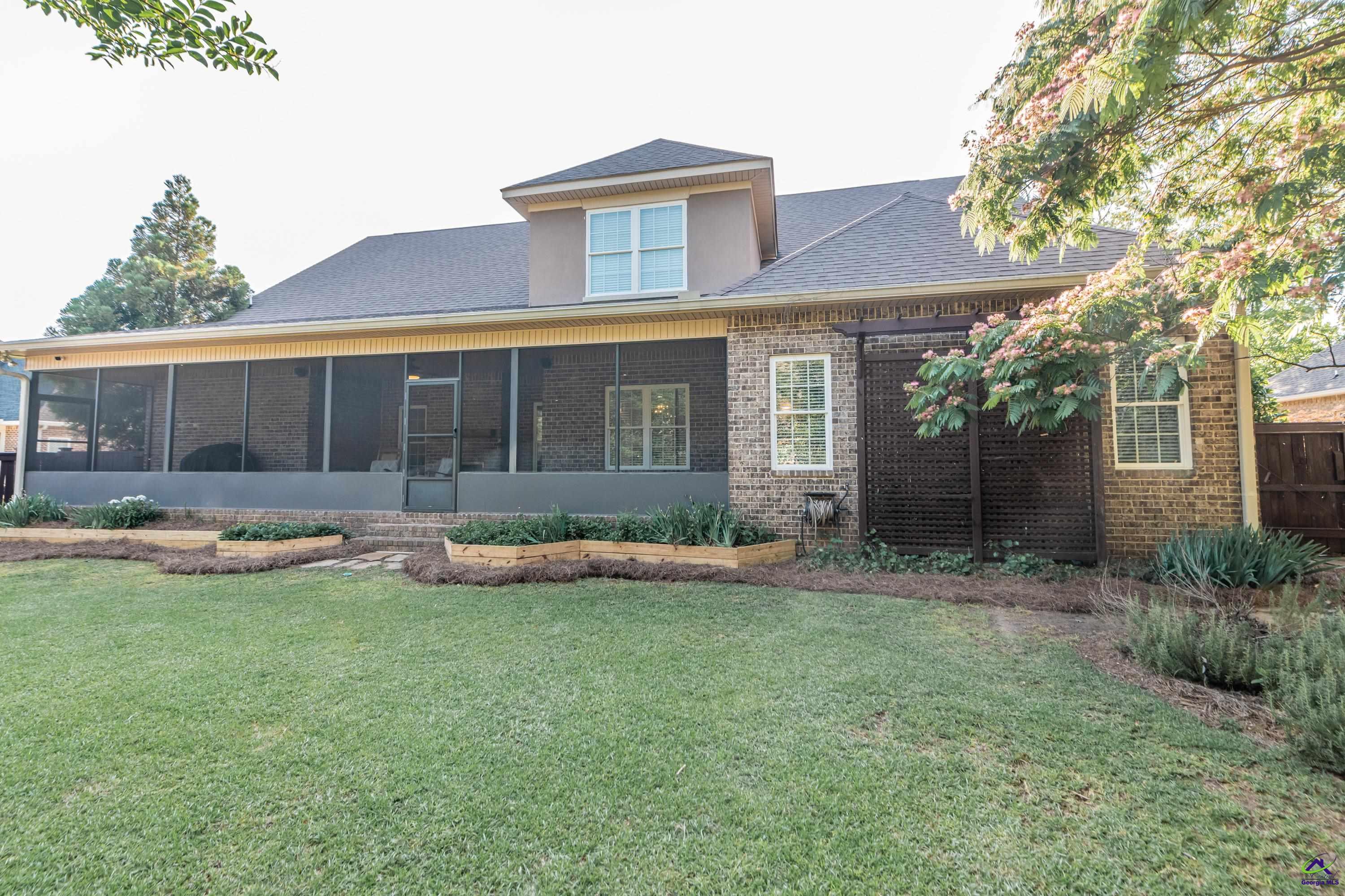 405 Old Bridge Road Warner Robins, GA 31088 - Photo 57 of 58 a view of a house with a yard and a patio