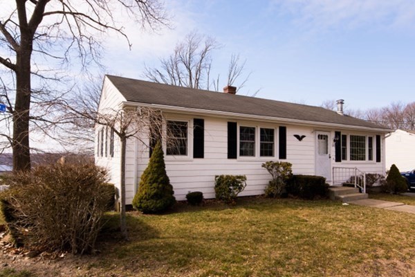 a front view of house with yard outdoor seating and barbeque oven