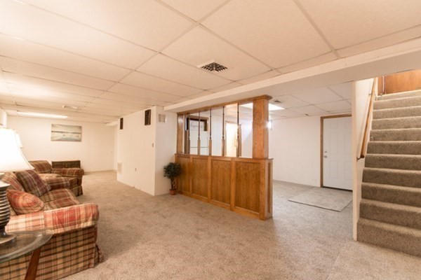 320 Quincy Street Fall River, MA 02720 - Photo 18 of 21 a living room with furniture and stairs