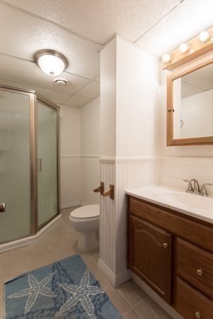 320 Quincy Street Fall River, MA 02720 - Photo 20 of 21 a bathroom with a toilet a sink and mirror