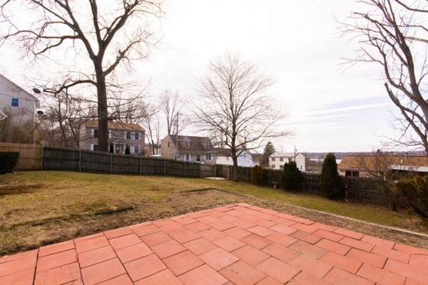 320 Quincy Street Fall River, MA 02720 - Photo 5 of 21 a view of a yard with trees
