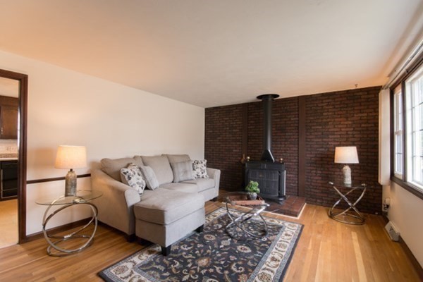 320 Quincy Street Fall River, MA 02720 - Photo 9 of 21 a living room with furniture and wooden floor