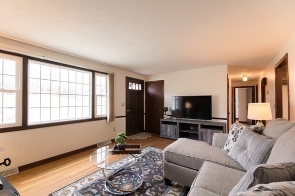 320 Quincy Street Fall River, MA 02720 - Photo 10 of 21 a living room with furniture and a flat screen tv