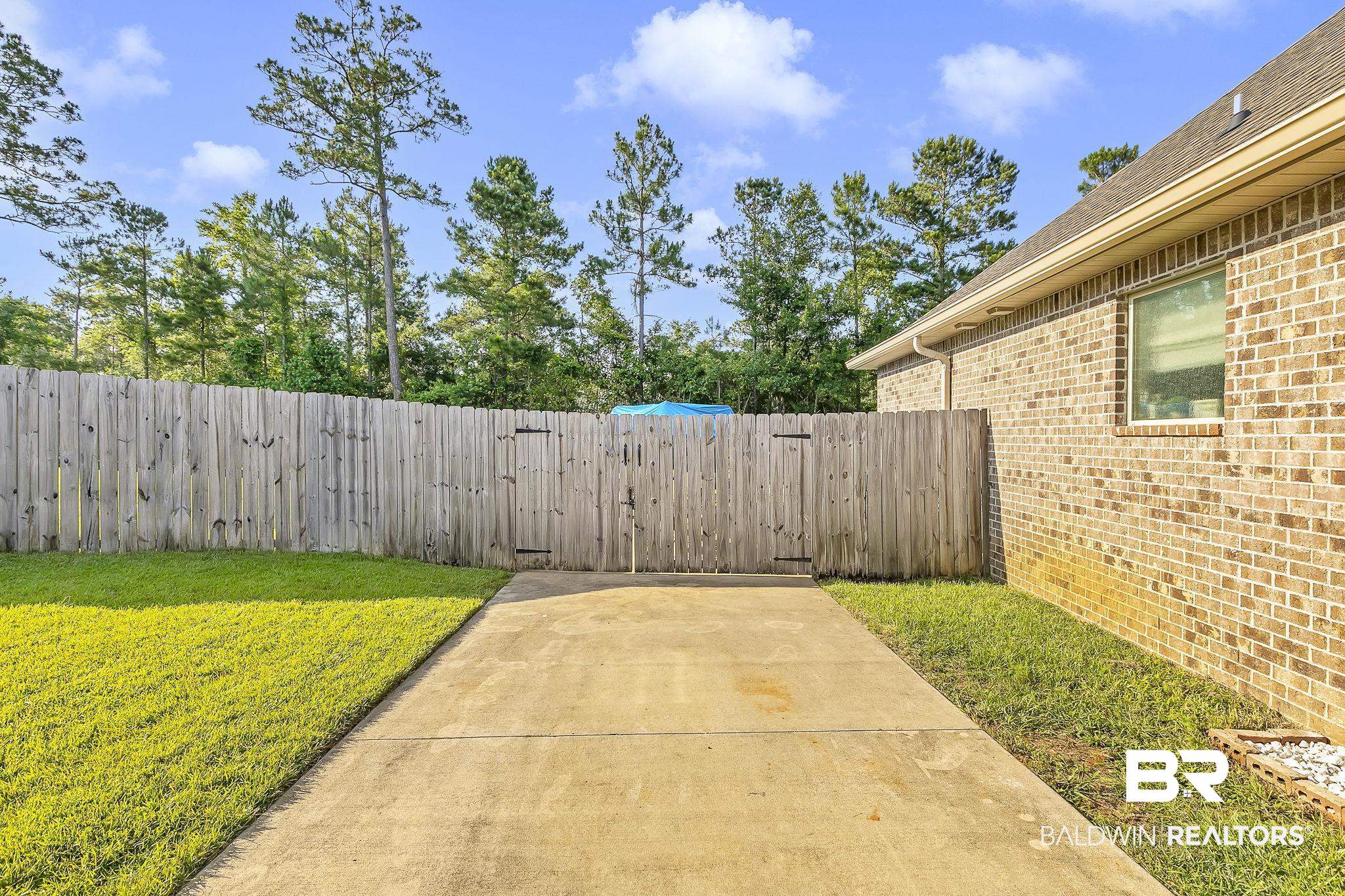 30635 Drayton Court Daphne, AL 36527 - Photo 46 of 51 View of yard featuring a gate and a patio