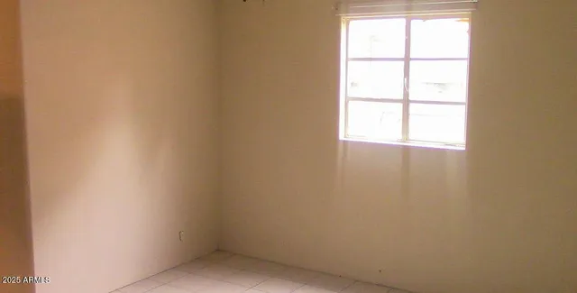 a bathroom with a toilet a bath tub and a window