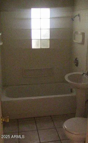 a bathroom with a sink and toilet