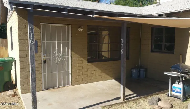 a view of hallway with closet and a bathroom