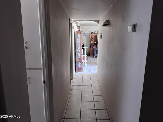 a kitchen with a refrigerator and a stove