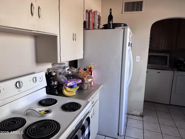 a bathroom with a toilet and a mirror