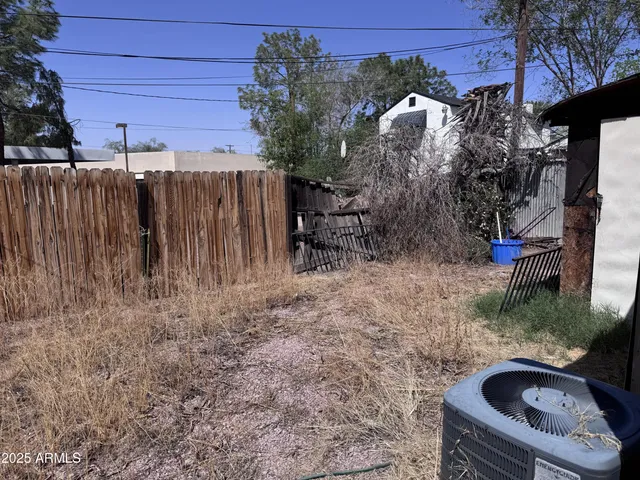 a view of backyard with cabin