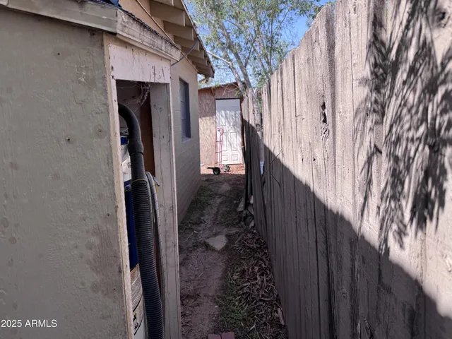 a view of a backyard of the house