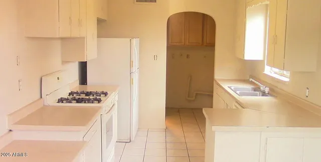 a bathroom with a sink a toilet and a shower