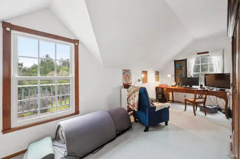 a bathroom with a sink toilet and mirror