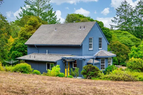 a living room with furniture a rug and a book shelf