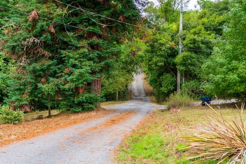 a kitchen with stainless steel appliances granite countertop a sink a stove and a microwave