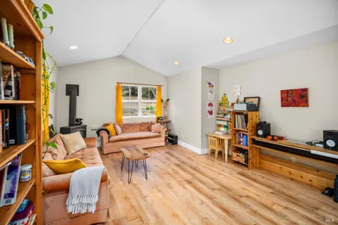 a bedroom with two beds and a couch