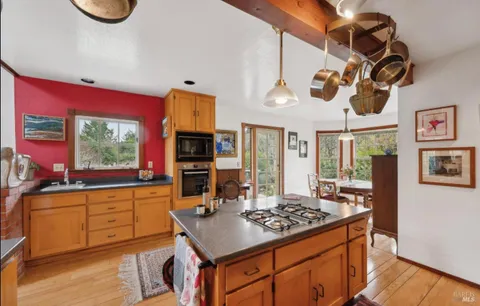 a view of a room that has a window and sink