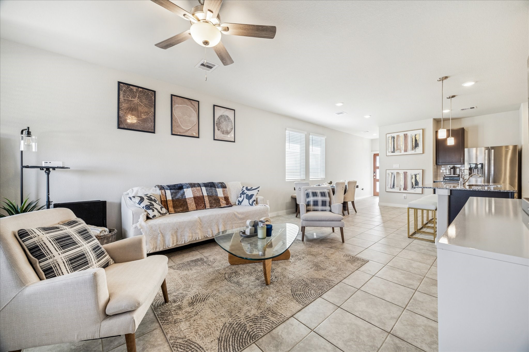 5547 Madden Lane Houston, TX 77048 - Photo 16 of 20 a living room with furniture and a dining table with wooden floor