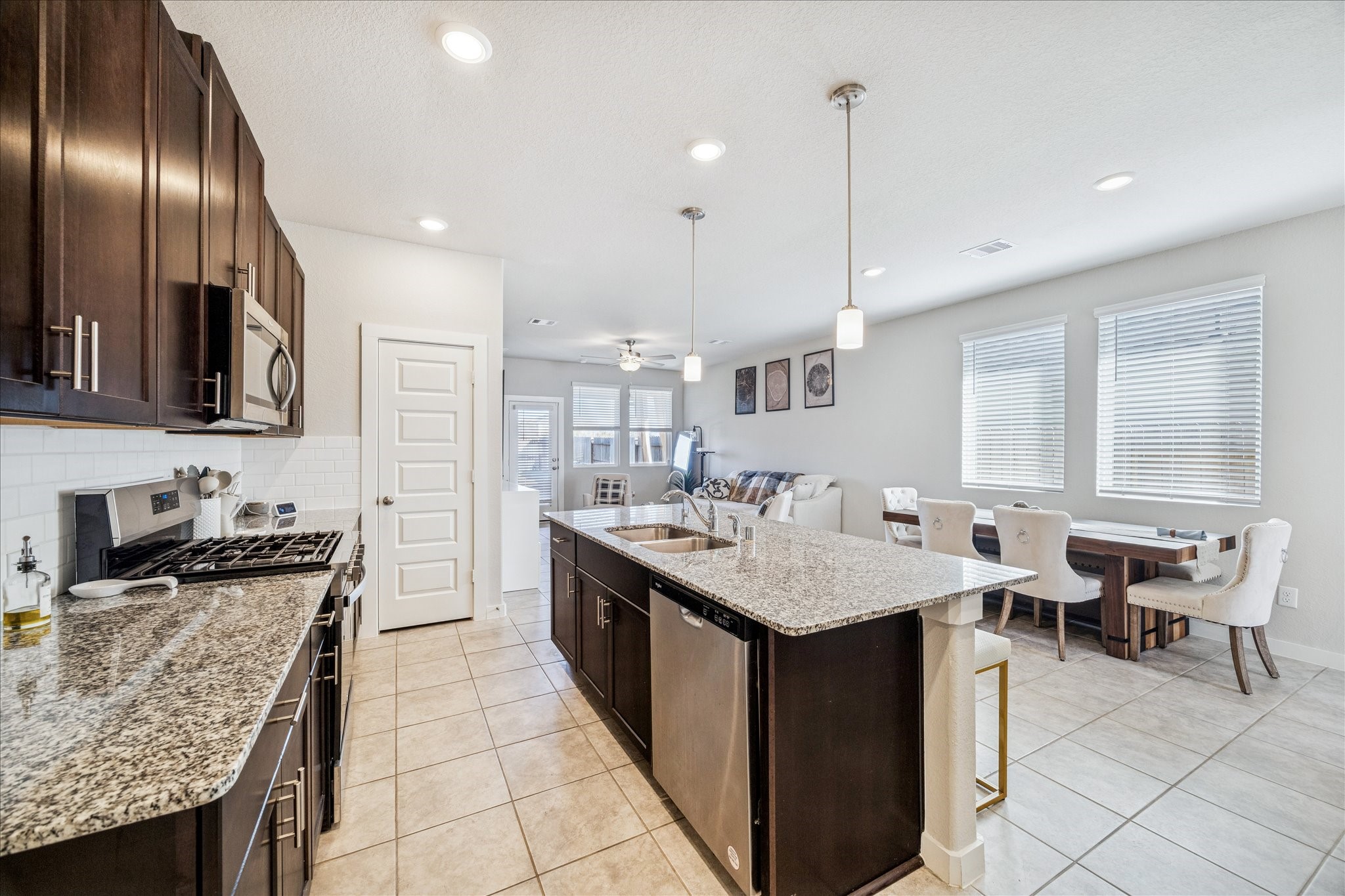 5547 Madden Lane Houston, TX 77048 - Photo 5 of 20 a kitchen with counter space sink stove and cabinets