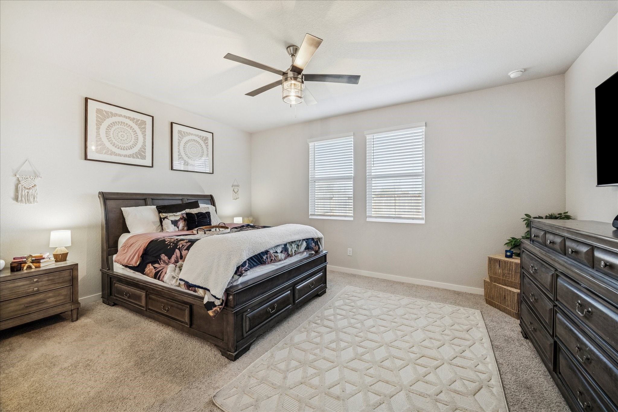 5547 Madden Lane Houston, TX 77048 - Photo 8 of 20 a bedroom with a bed and a ceiling fan