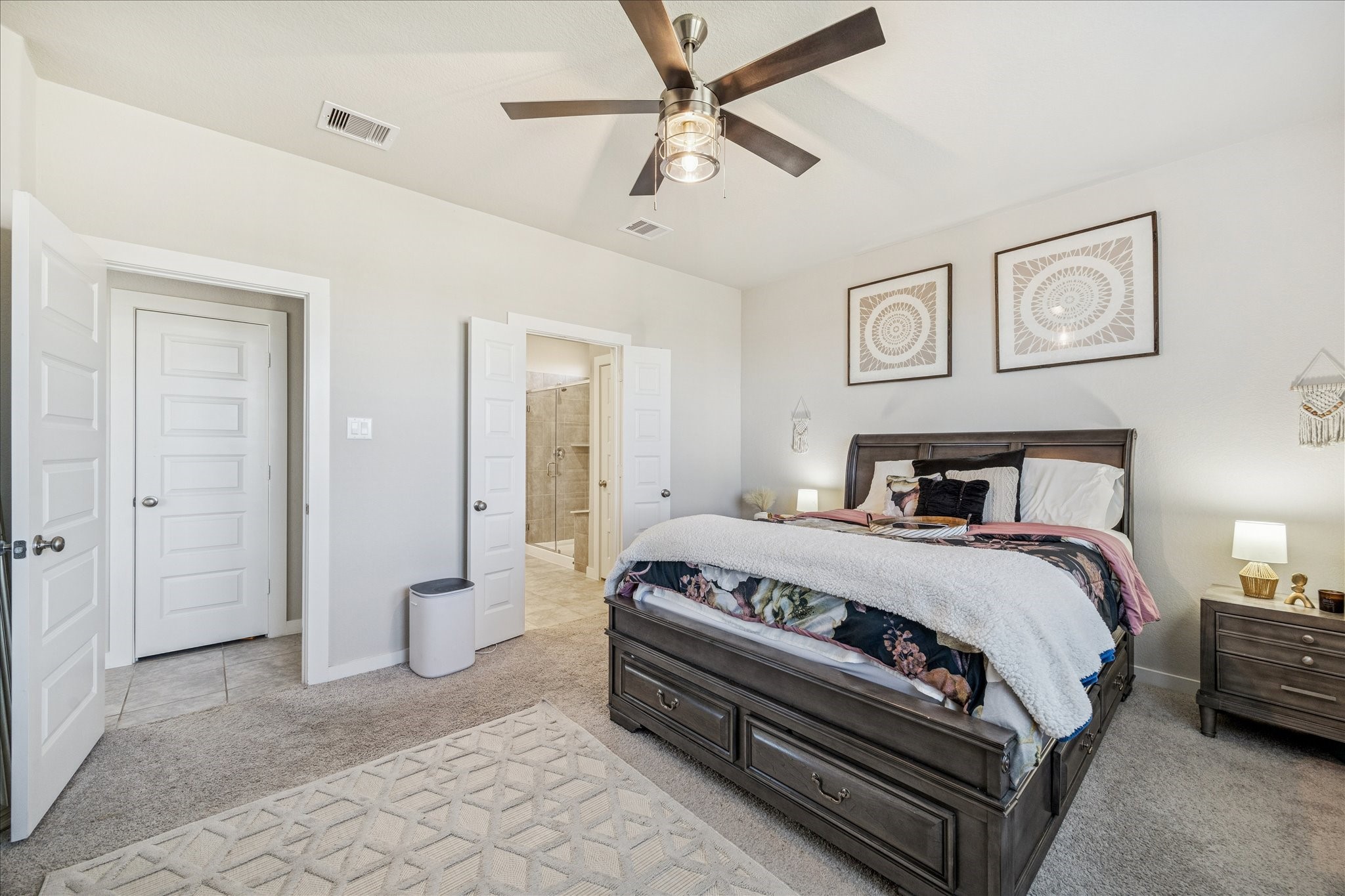 5547 Madden Lane Houston, TX 77048 - Photo 9 of 20 a spacious bedroom with a bed and a chandelier