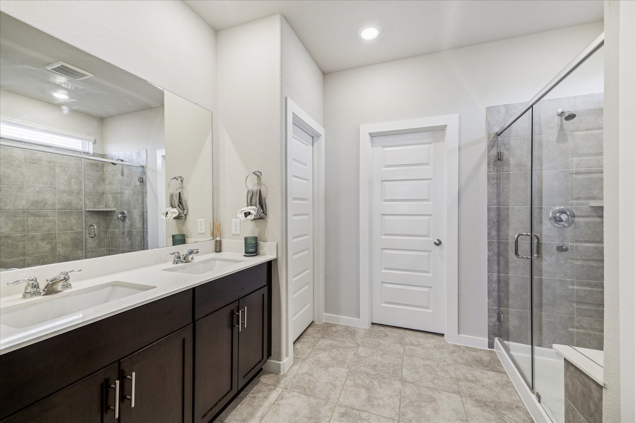 5547 Madden Lane Houston, TX 77048 - Photo 10 of 20 a spacious bathroom with a double vanity sink mirror and shower