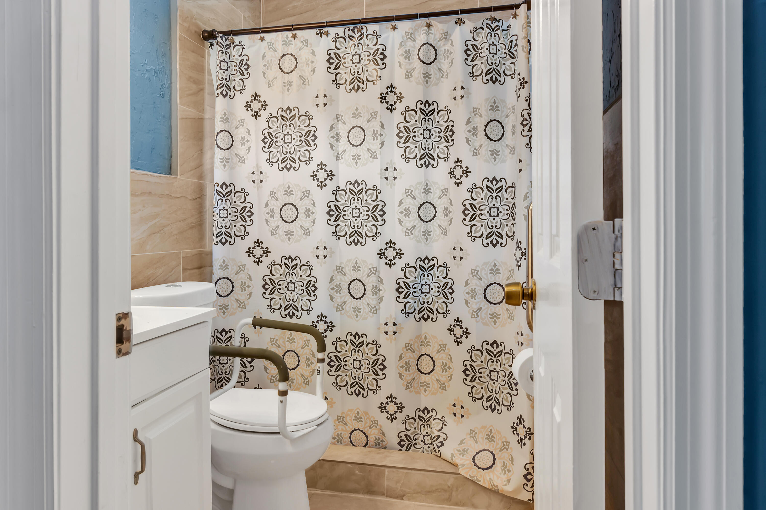 4340 Wilkinson Drive Lake Worth, FL 33461 - Photo 12 of 12 a white toilet sitting next to a shower curtain