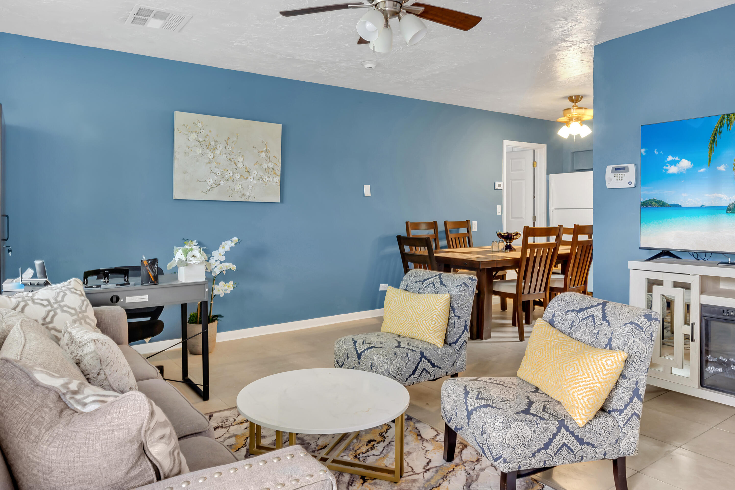 4340 Wilkinson Drive Lake Worth, FL 33461 - Photo 2 of 12 a living room with furniture and kitchen view
