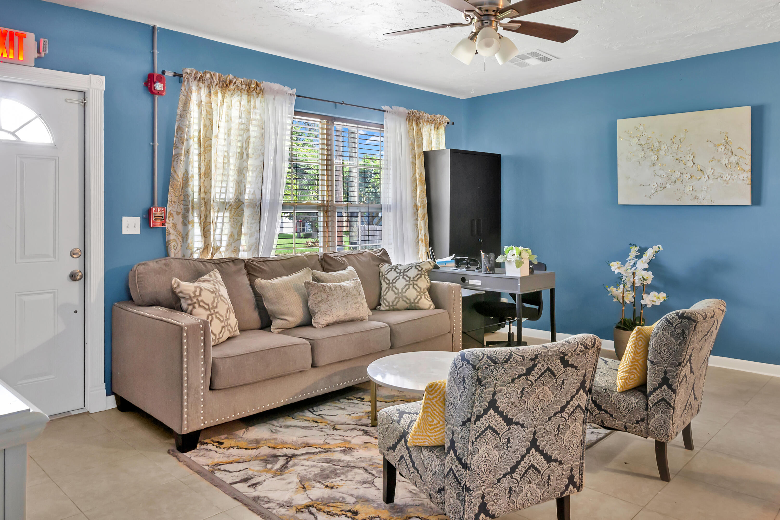 4340 Wilkinson Drive Lake Worth, FL 33461 - Photo 3 of 12 a living room with furniture and a large window