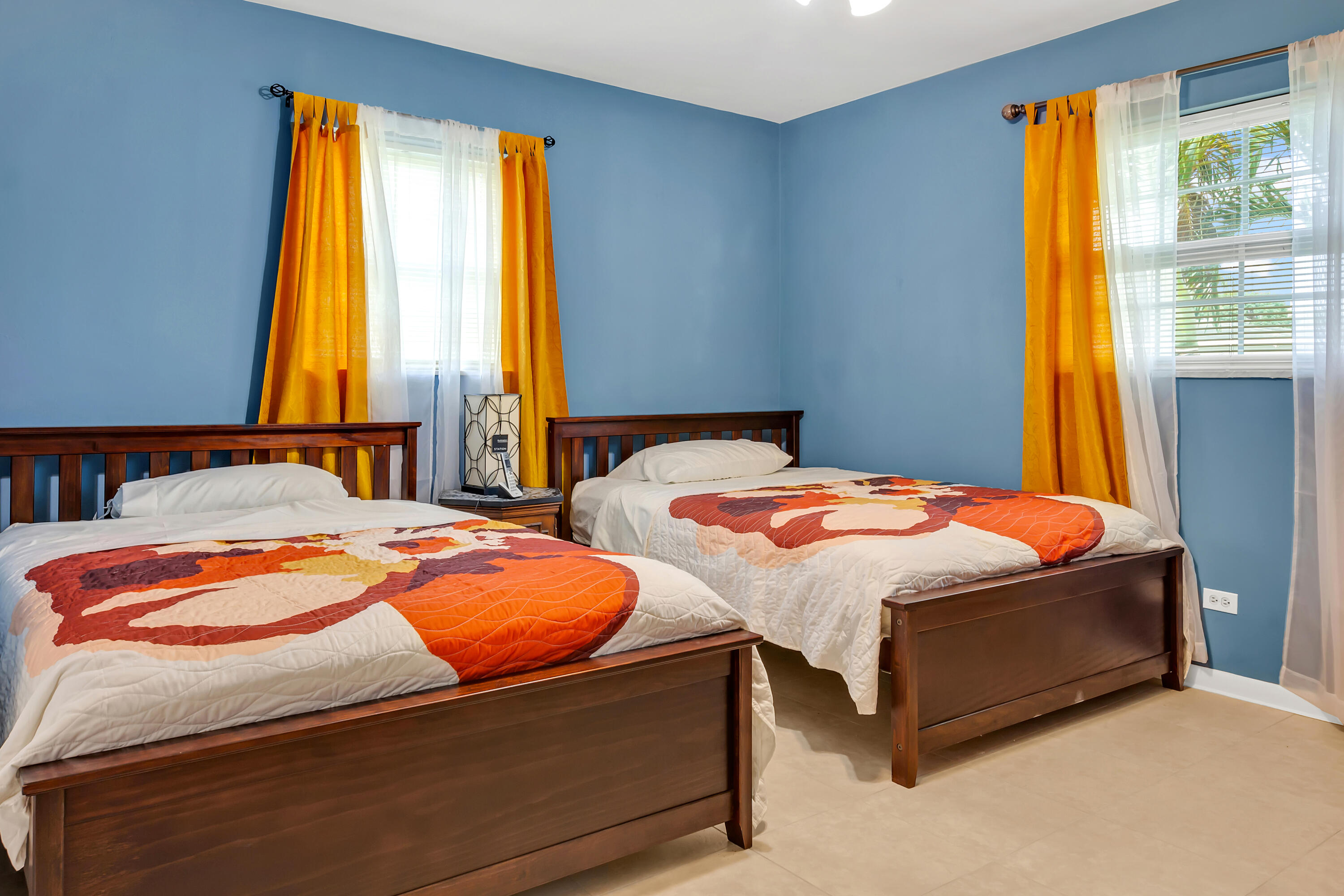 4340 Wilkinson Drive Lake Worth, FL 33461 - Photo 9 of 12 a bedroom with two beds and next to a window