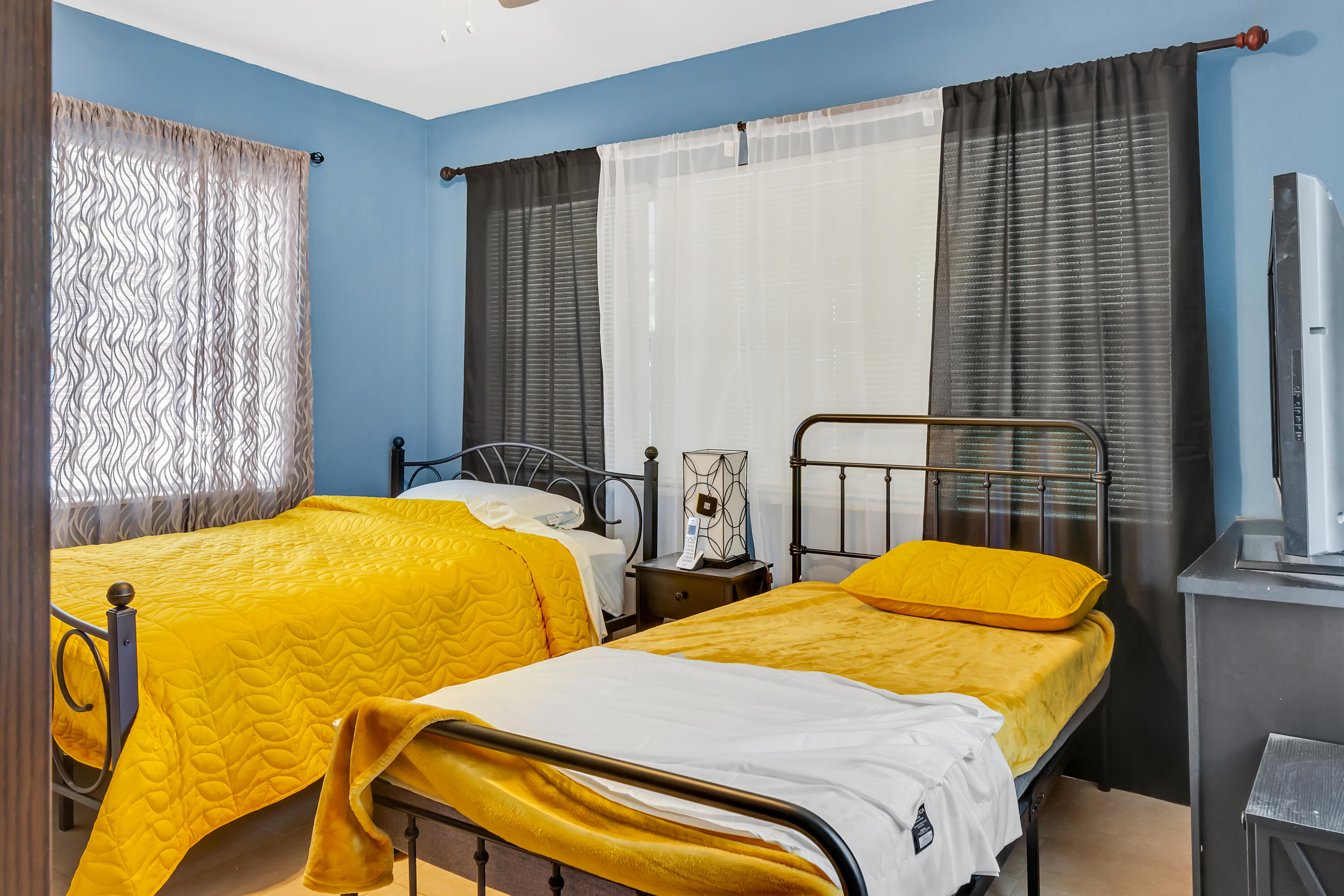 4340 Wilkinson Drive Lake Worth, FL 33461 - Photo 10 of 12 a bedroom with 2 bed and a window