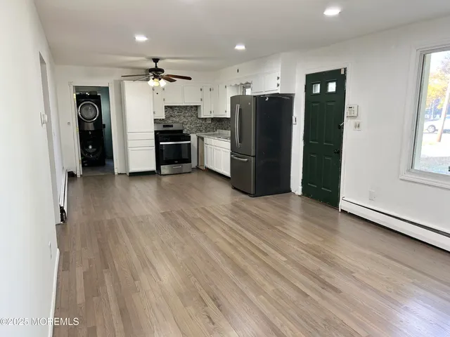 a view of kitchen view wooden floor and window