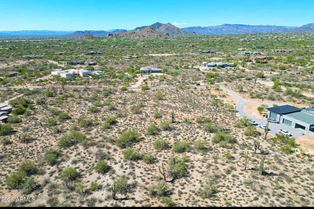 a view of a city with mountains in the background