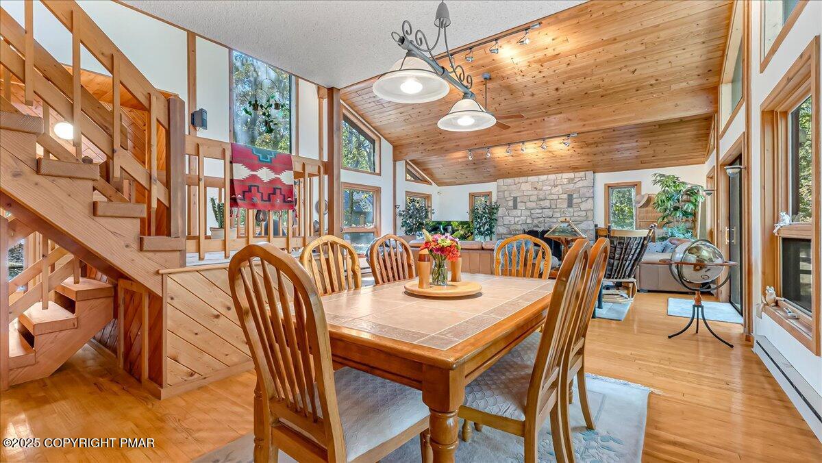297 Forest Drive Canadensis, PA 18325 - Photo 11 of 58 a dining room with furniture and wooden floor