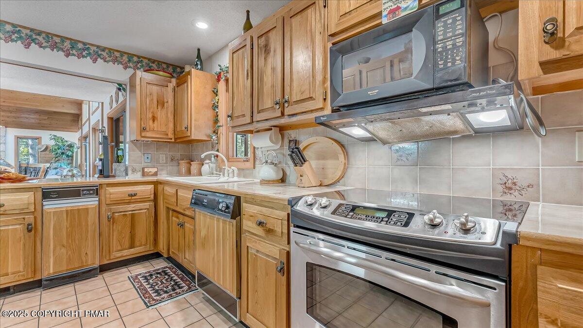 297 Forest Drive Canadensis, PA 18325 - Photo 13 of 58 a kitchen with a stove and a sink