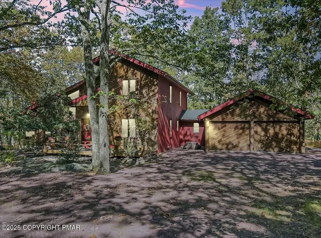 a tree in front of a house
