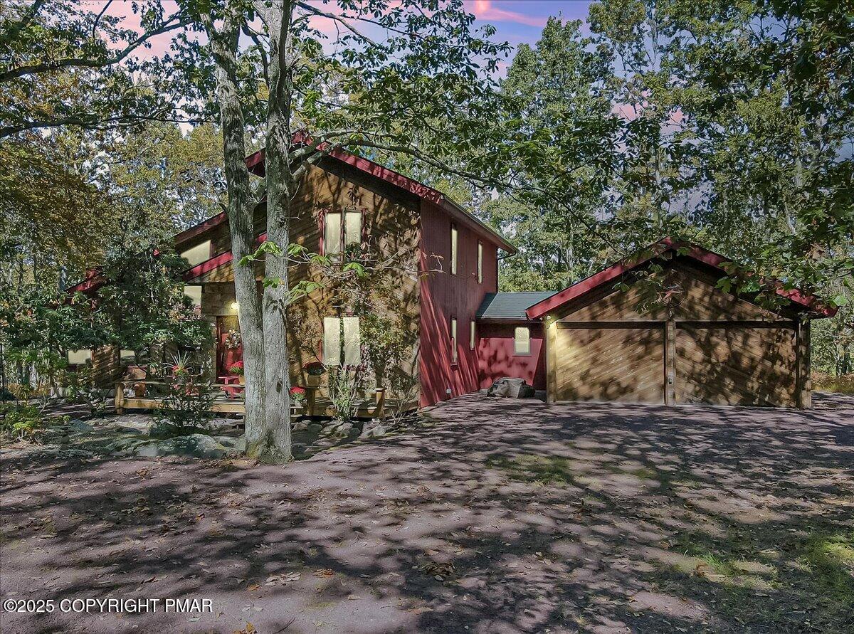 297 Forest Drive Canadensis, PA 18325 - Photo 2 of 58 a tree in front of a house