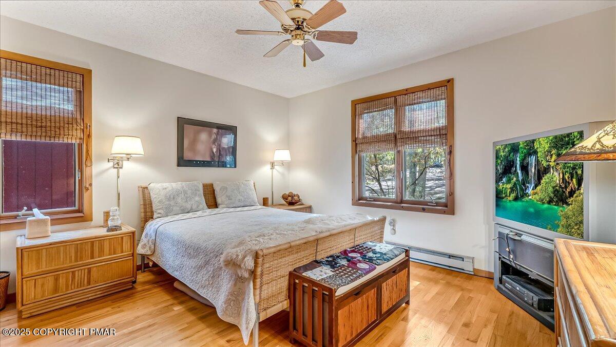 297 Forest Drive Canadensis, PA 18325 - Photo 21 of 58 a bedroom with a bed and a window