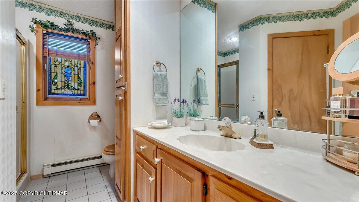 297 Forest Drive Canadensis, PA 18325 - Photo 23 of 58 a bathroom with a sink and a mirror