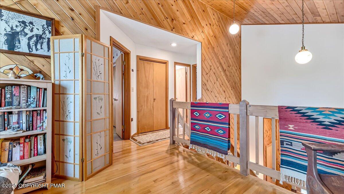 297 Forest Drive Canadensis, PA 18325 - Photo 28 of 58 a view of a hallway with entryway wooden floor and front door