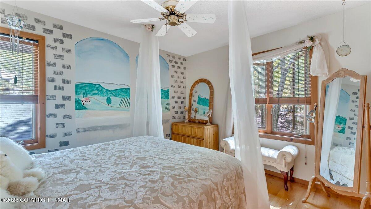 297 Forest Drive Canadensis, PA 18325 - Photo 29 of 58 a bedroom with a bed and dresser with mirror
