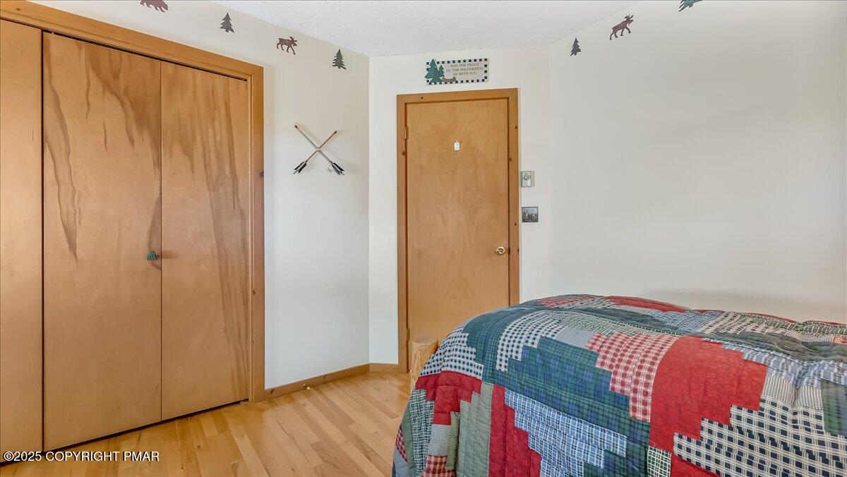 297 Forest Drive Canadensis, PA 18325 - Photo 32 of 58 a bedroom with a bed and a dresser