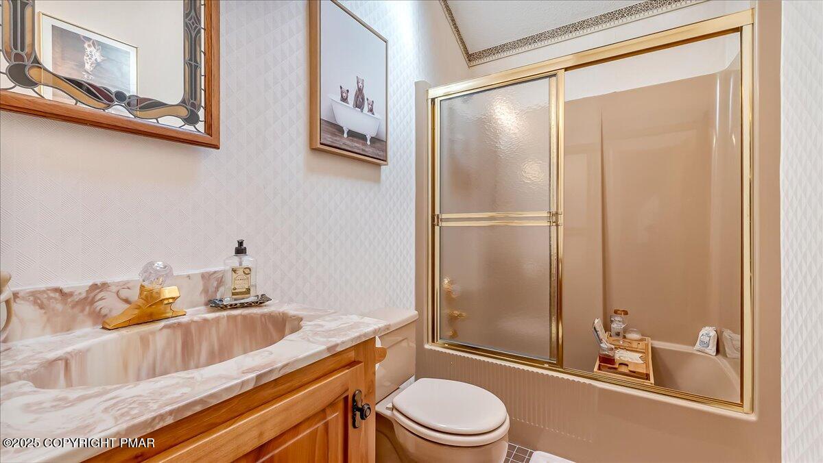 297 Forest Drive Canadensis, PA 18325 - Photo 33 of 58 a bathroom with a granite countertop sink toilet and shower