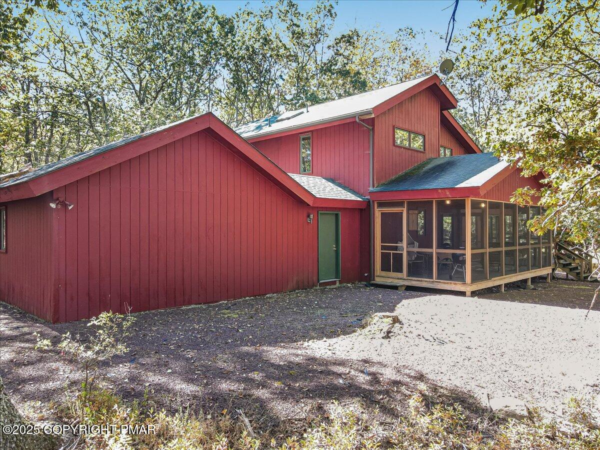 297 Forest Drive Canadensis, PA 18325 - Photo 38 of 58 a view of a house with a yard and garage