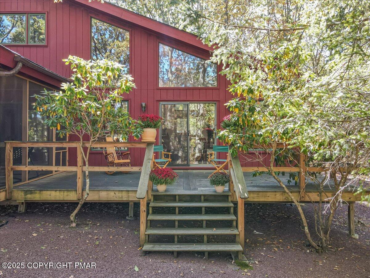 297 Forest Drive Canadensis, PA 18325 - Photo 39 of 58 a view of a wooden chairs and a table in the back yard