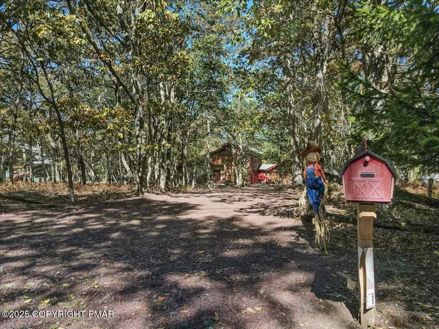 a view of a park with iron fence